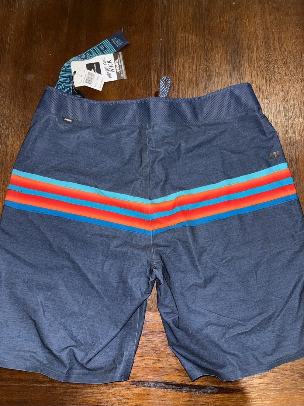 Rip Curl Mirage Mick Fanning Navy Board Shorts with Red & Aqua Stripes 34
